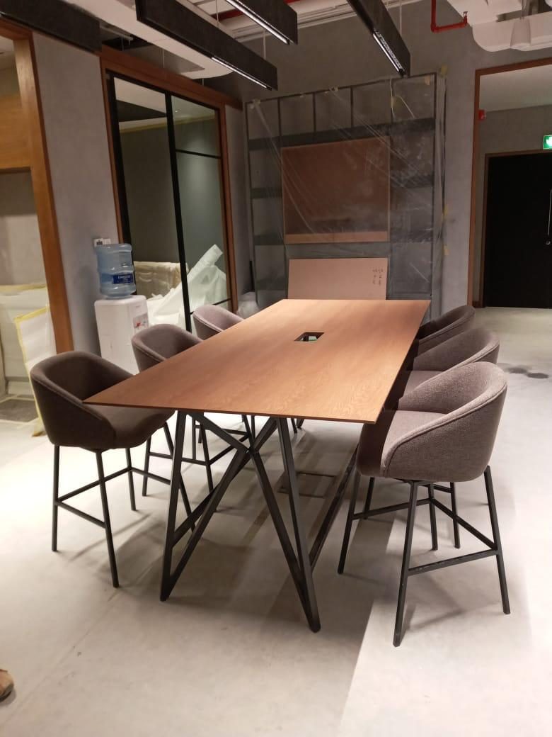 Meeting table with upholstered chairs in the office