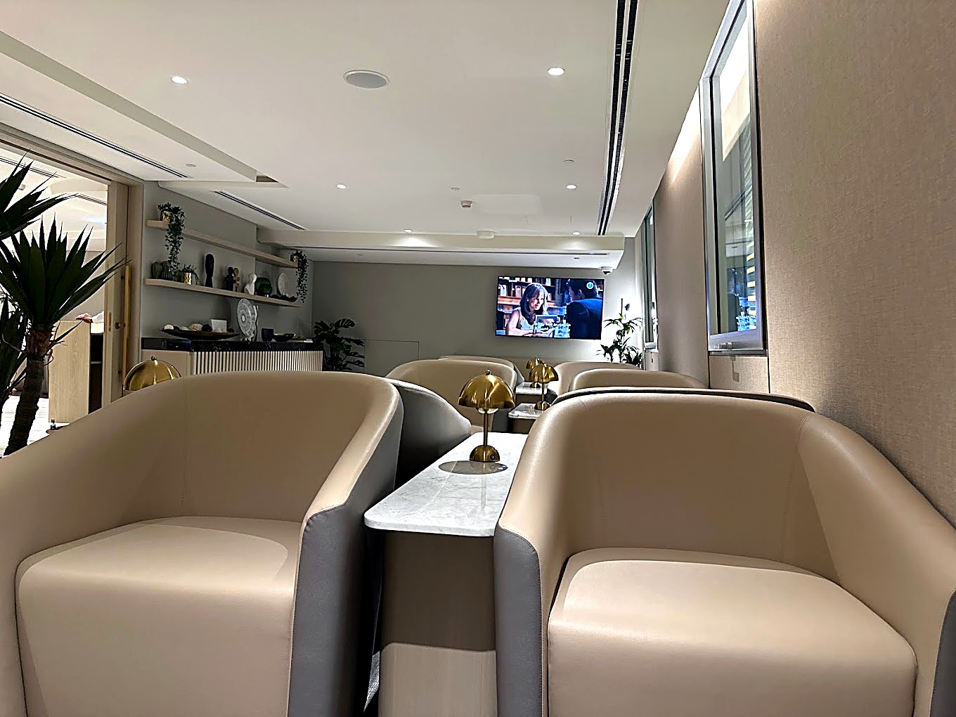 Cream upholstered booth seating with timber dividers along the lounge
