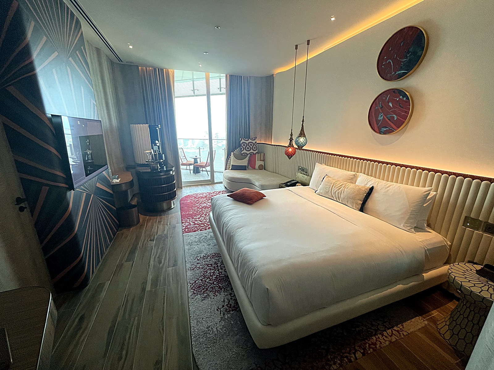 Bedroom with a slatted timber headboard wall and a framed artwork